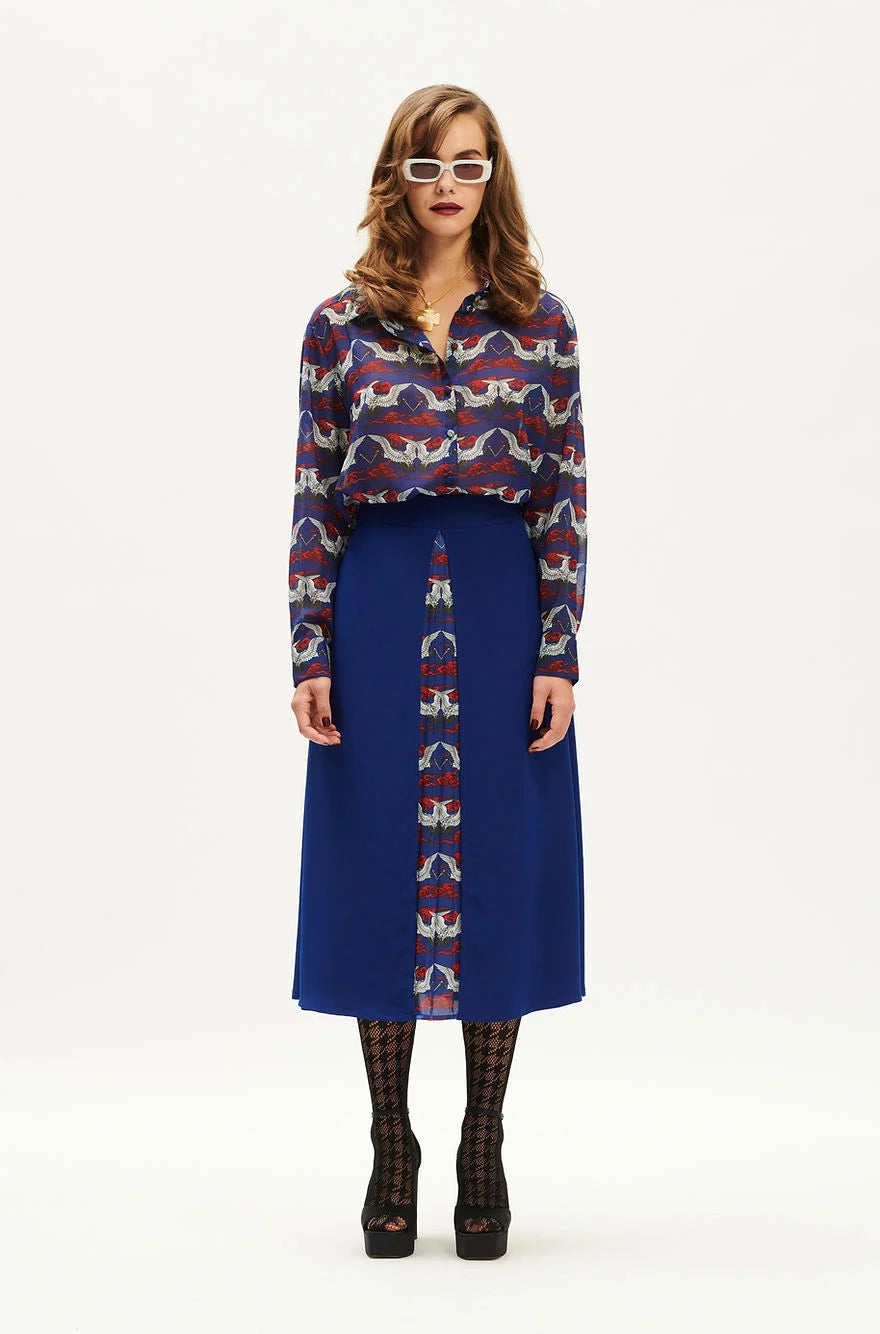 WE_ARE indigo A-line pleated midi skirt front view. SOPHiEL
