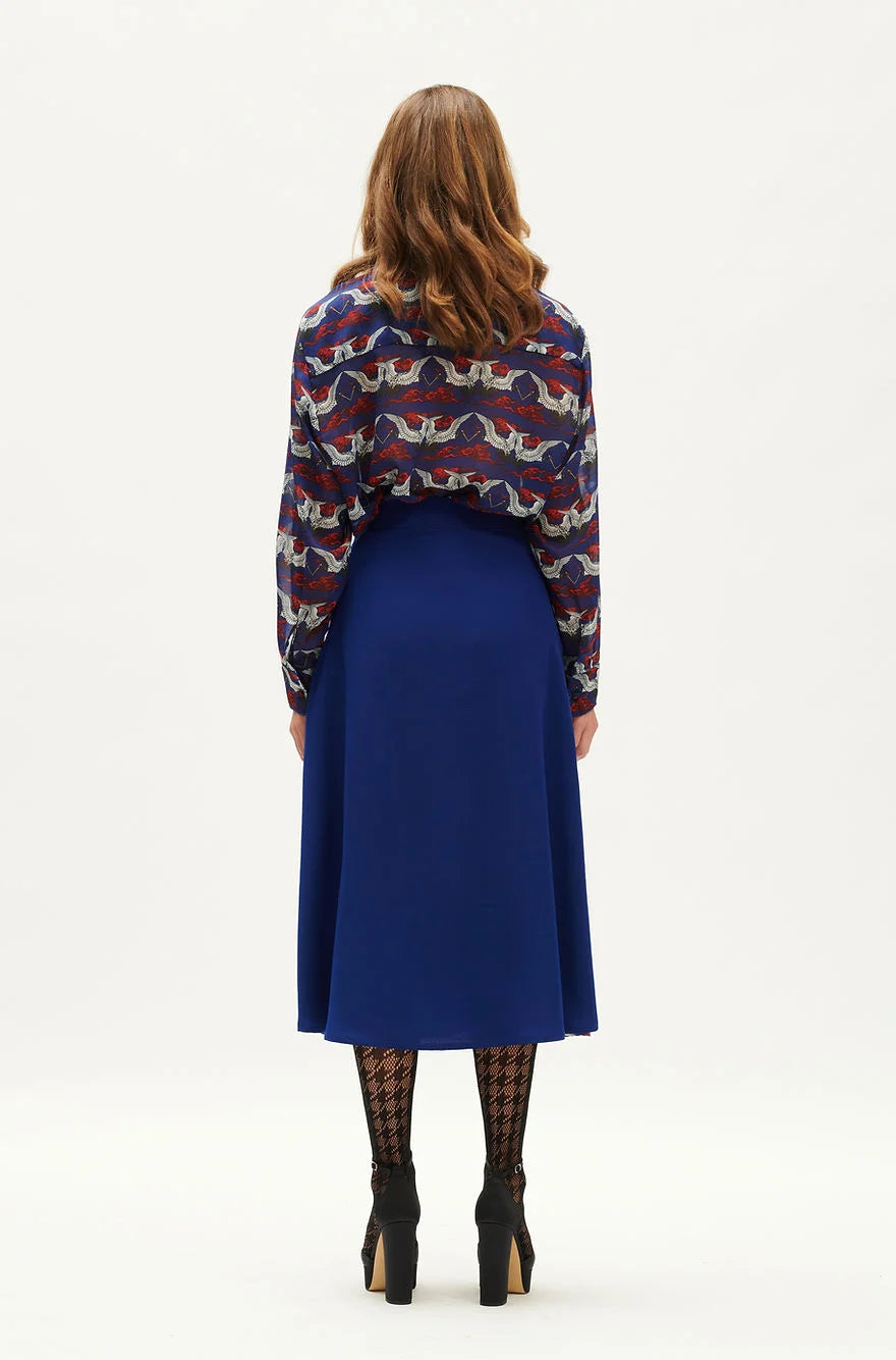 WE_ARE indigo A-line pleated midi skirt back view. SOPHiEL