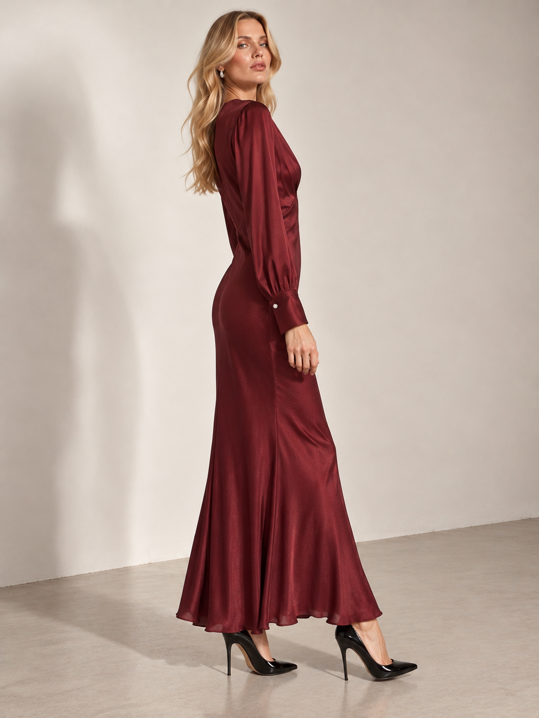 Side view of the Ottod'Ame burgundy long-sleeve evening dress. SOPHiEL