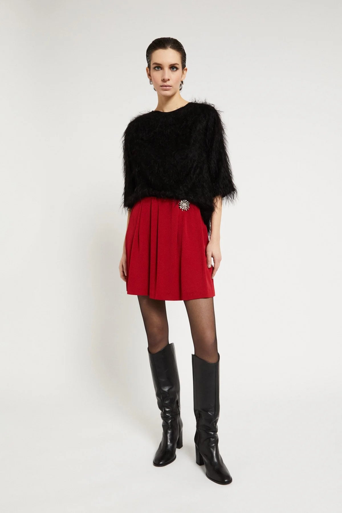 Ottod'Ame black fluffy sweater with 3/4 sleeves styled with red skirt
