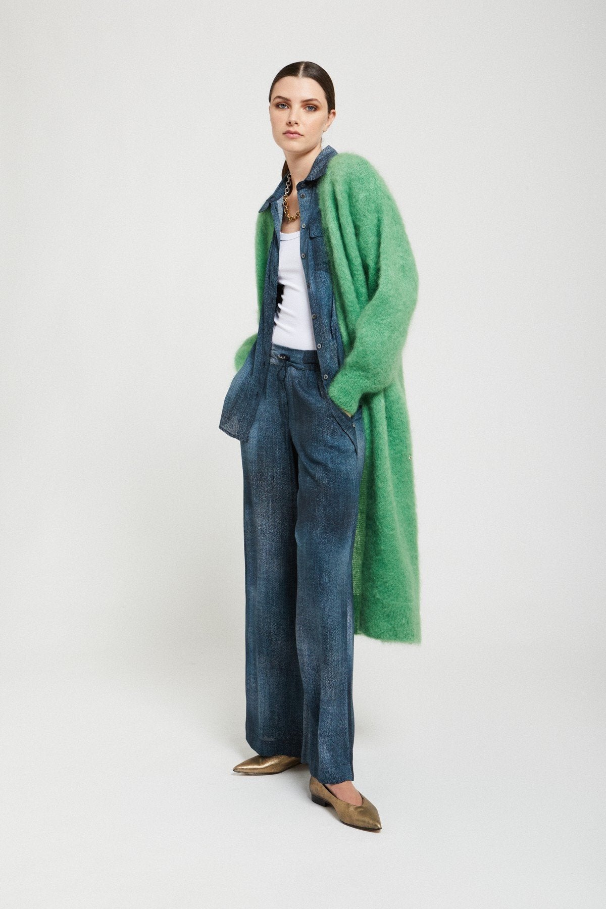 Side view of the Ottod’Ame green mohair blend cardigan featuring its elongated fit and soft textured knit.
