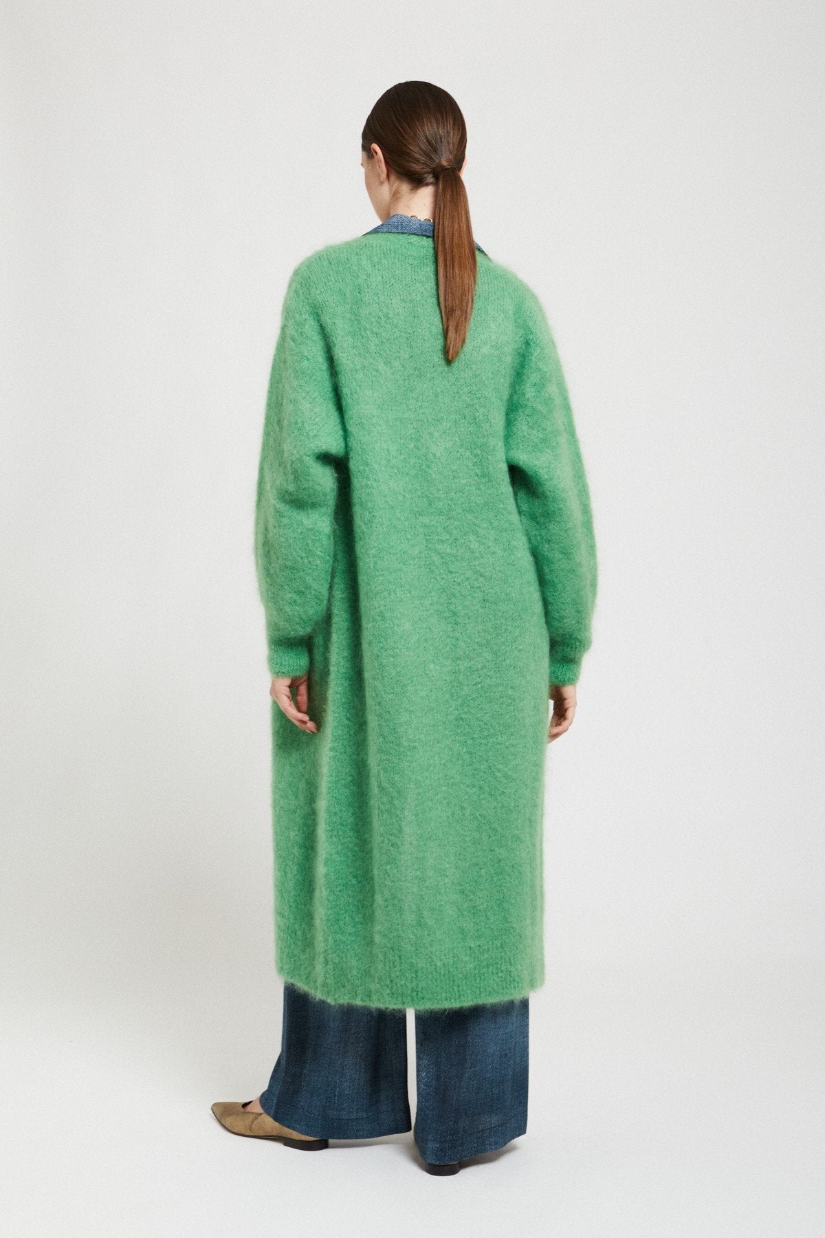 Back view of the Ottod’Ame green fluffy long cardigan showing its relaxed silhouette and long sleeves.