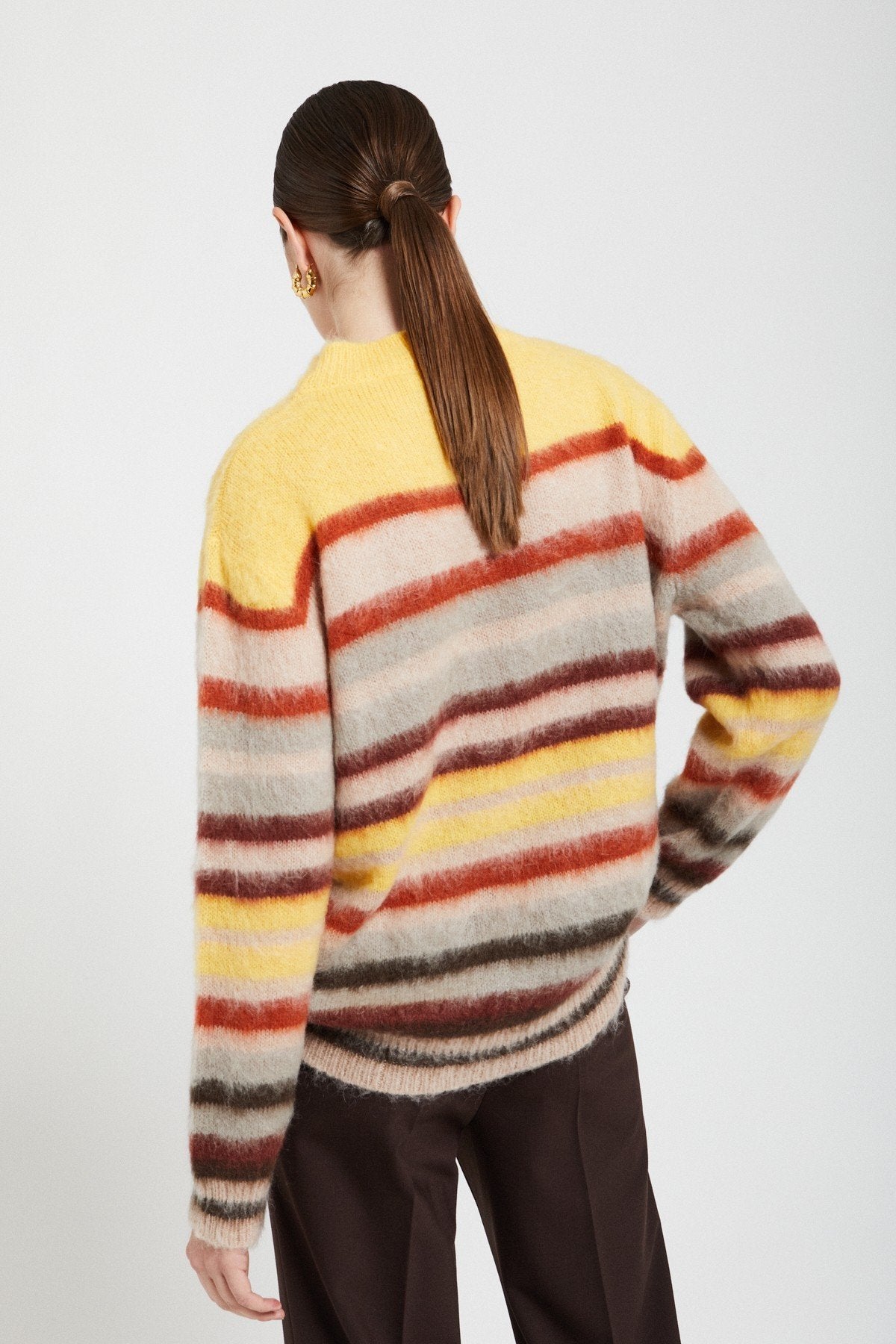 Back view of the Ottod’Ame multicolor striped jumper showing its relaxed fit and colorful knit pattern.
