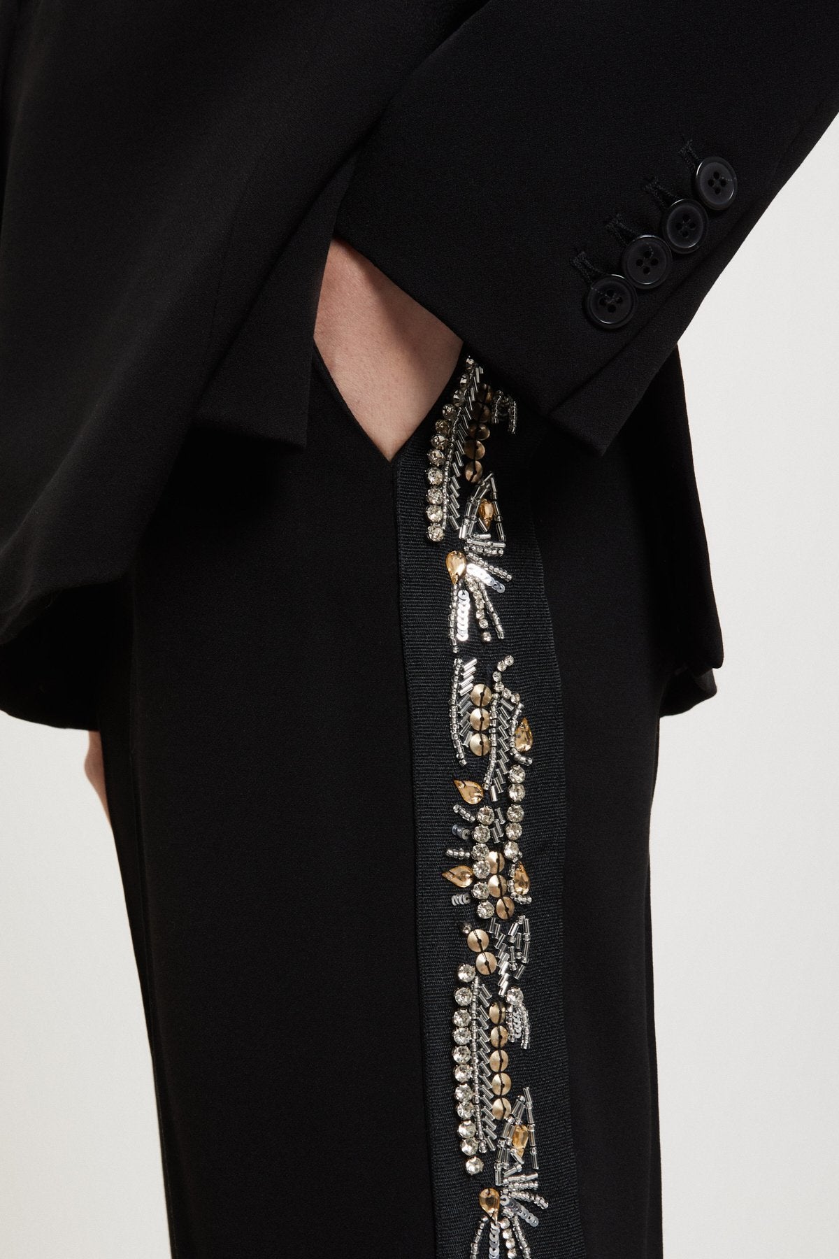 Ottod'Ame black trousers with hand-embroidered floral side detailing close-up