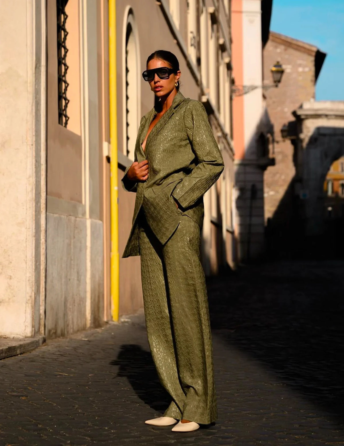 KateJo Collections olive green geometric print wide-leg trousers styled with blazer