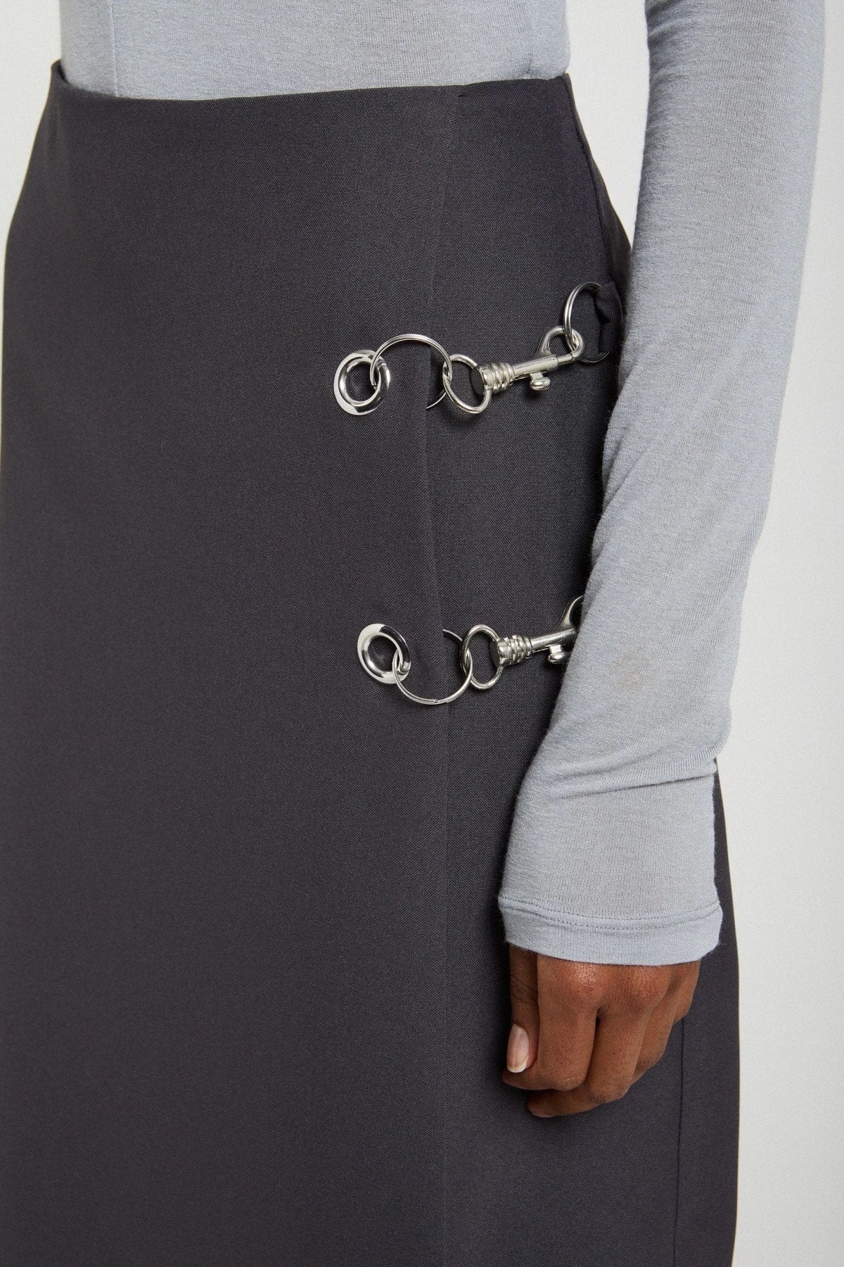 Ottod'Ame black skirt with silver grommet and chain detail close-up