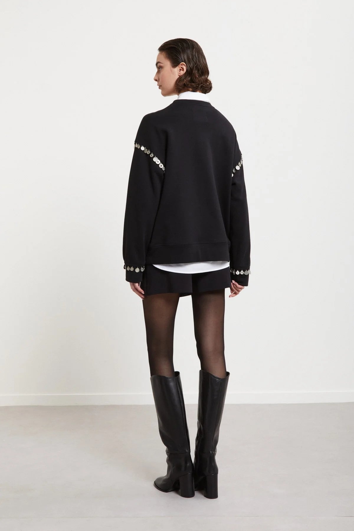 Back view of Ottod’Ame black embellished sweatshirt with long sleeves