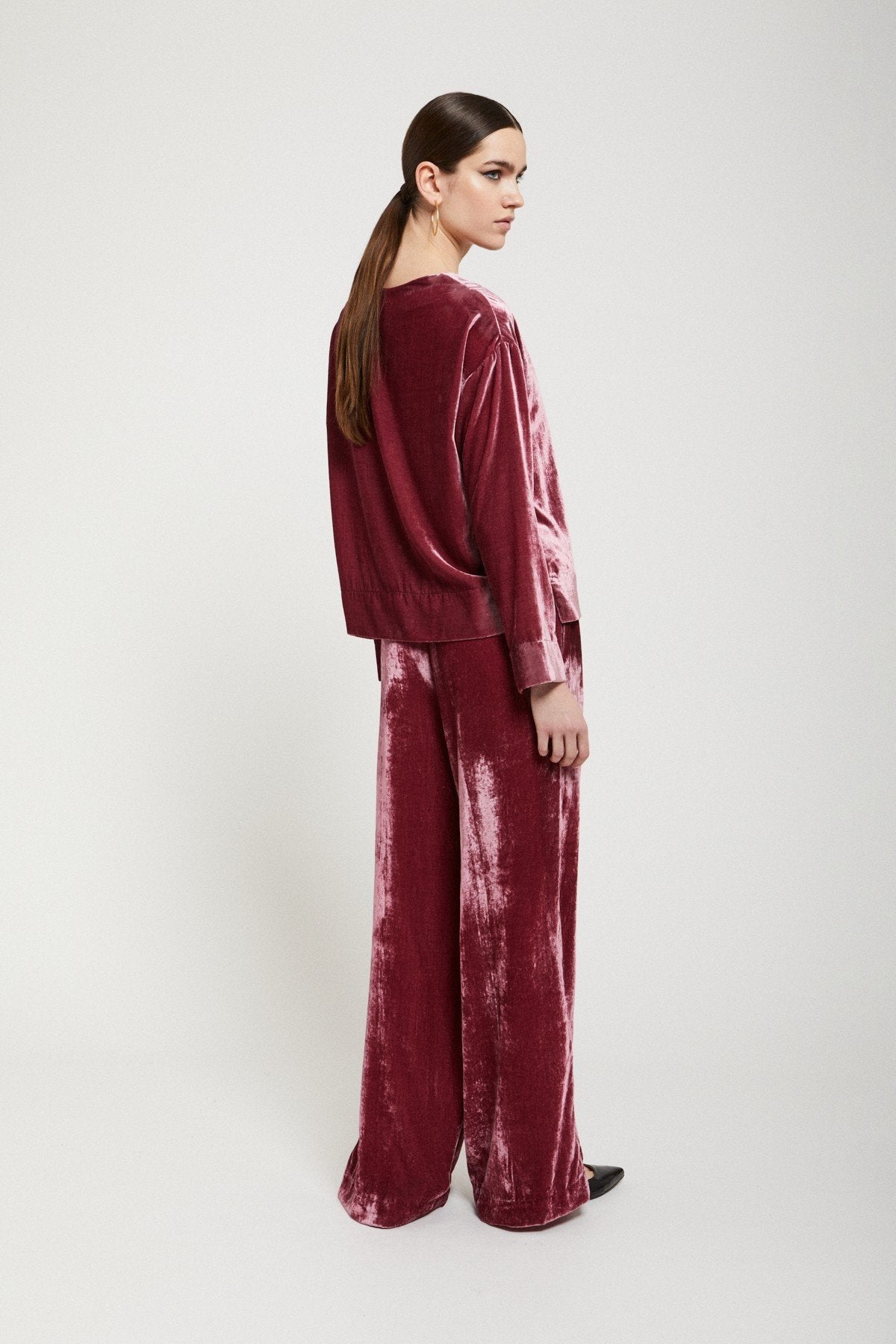 Red velvet palazzo trousers shown from the back. SOPHiEL