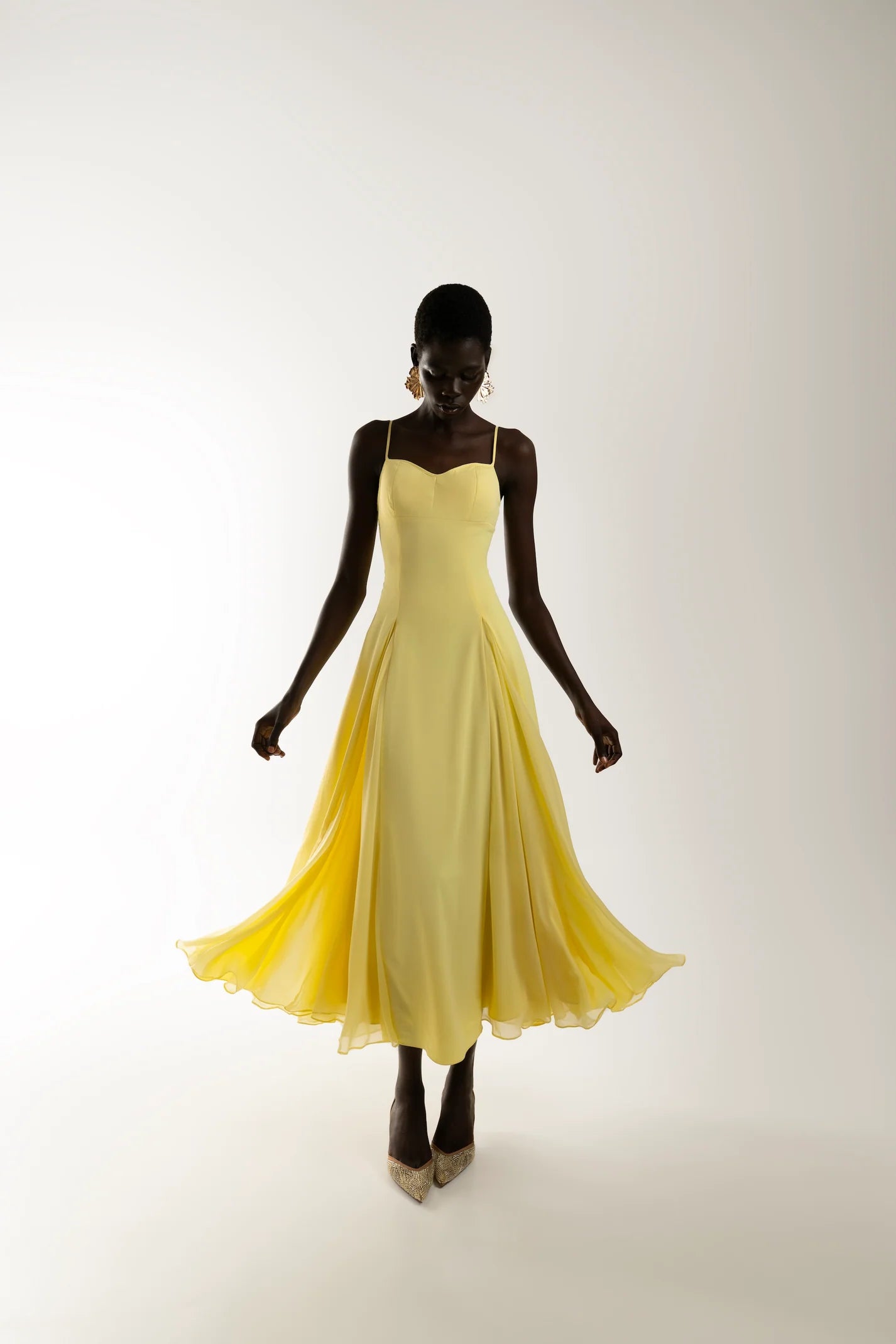 Butter Yellow A-line maxi dress in motion, lightweight fabric and feminine silhouette
