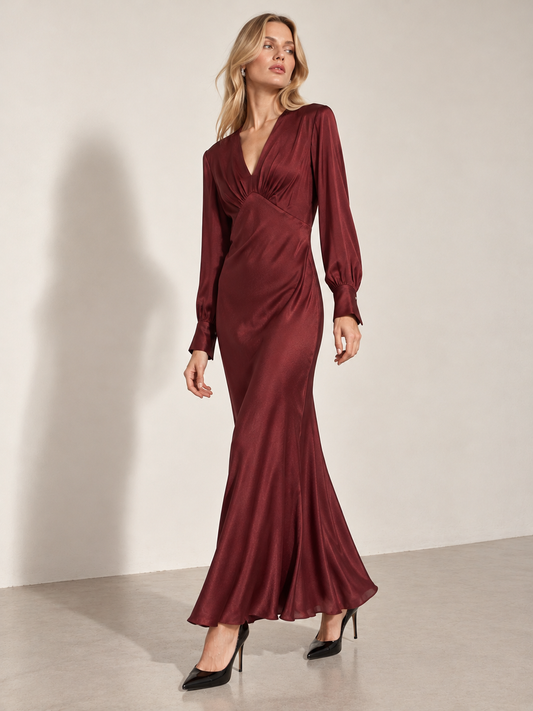 Ottod'Ame burgundy satin maxi evening dress with long sleeves and a V-neckline.