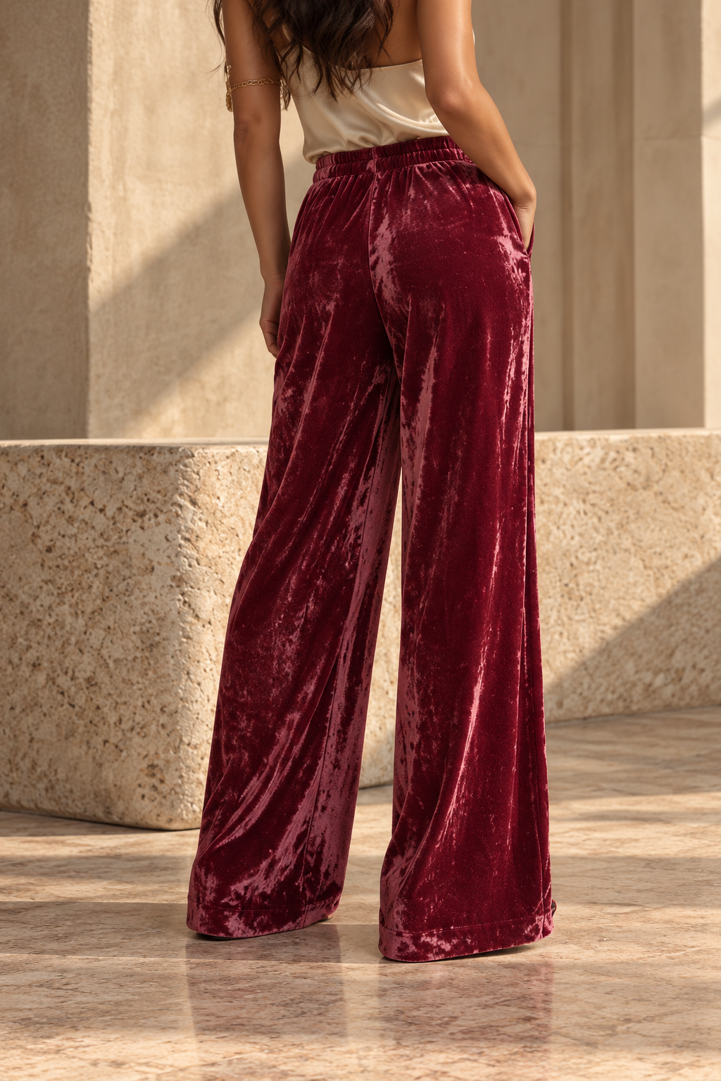 Red velvet palazzo trousers shown from the back. SOPHiEL