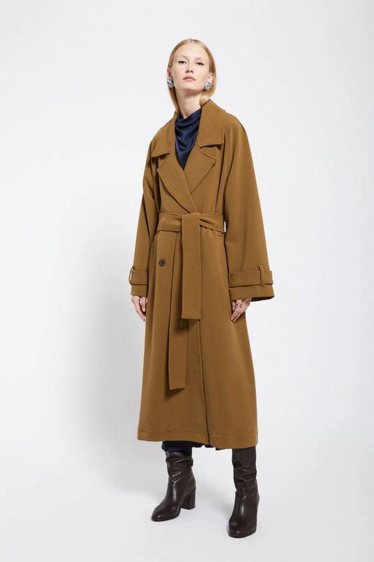 Ottod'Ame camel double-breasted trench coat with oversized lapels and a belted waist.