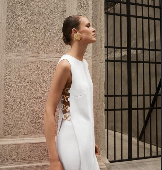 Side view of white cutout tank top with wide trousers set