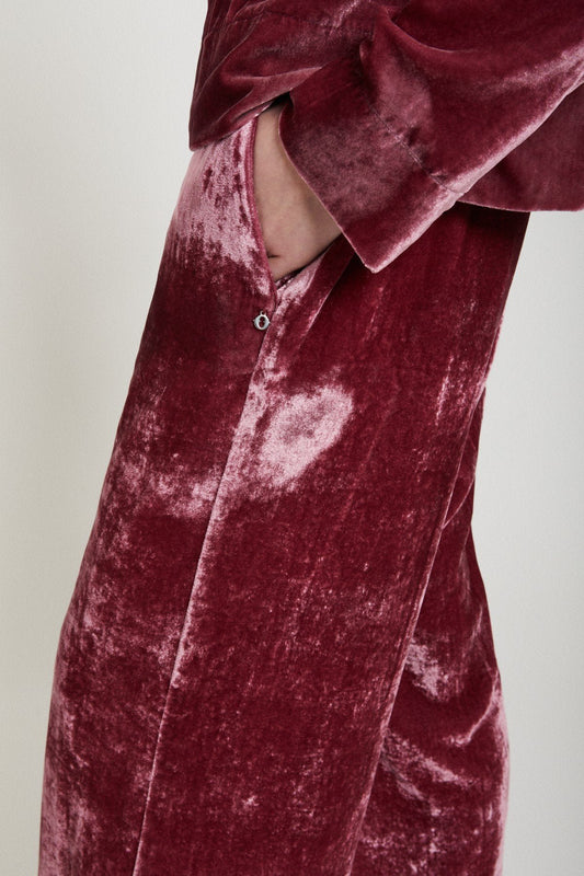 Close-up of red velvet fabric on Ottod’Ame palazzo trousers