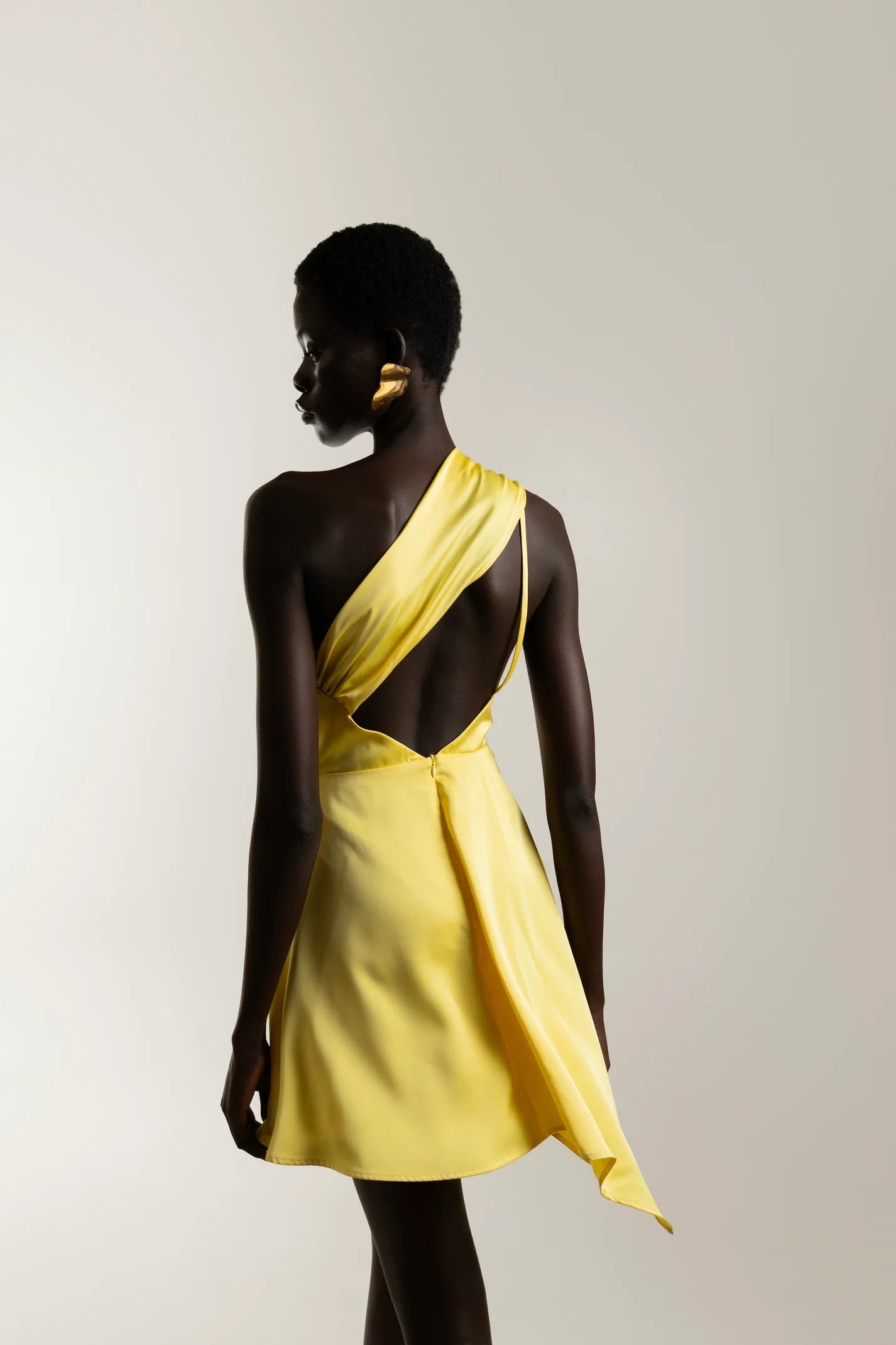 structured yellow mini dress with flared skirt