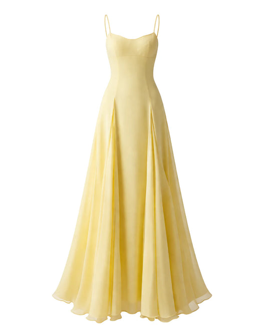 Yellow maxi dress with thin straps and flowing A-line silhouette. Sophiel